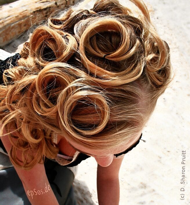 Sort of the drastic version of the Swirled Fringe (below), this style is any of a number of elaborate curls and twists all neatly pinned against the head.